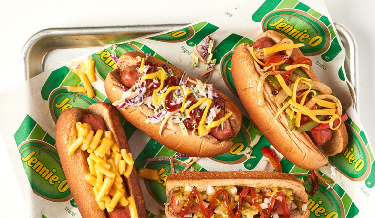 Turkey franks with various toppings on a tray